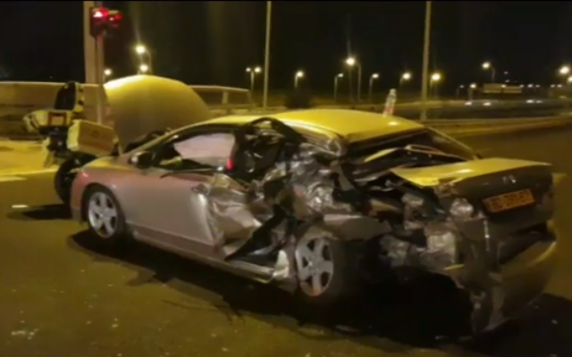 A car hit by a vehicle that attempted to flee police on the Ayalon Highway, October 25, 2019 (video screen grab) A car hit by a vehicle that attempted to flee police on the Ayalon Highway, October 25, 2019 (video screen grab)
