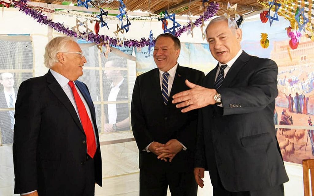 US Secretary of State Mike Pompeo (center) visits the prime minister's holiday sukkah, during talks with Prime Minister Benjamin Netanyahu on October 18, 2019. At left is US Ambassador to Israel David Friedman. (Amos Ben Gershom/GPO) US Secretary of State Mike Pompeo (center) visits the prime minister's holiday sukkah, during talks with Prime Minister Benjamin Netanyahu on October 18, 2019. At left is US Ambassador to Israel David Friedman. (Amos Ben Gershom/GPO)