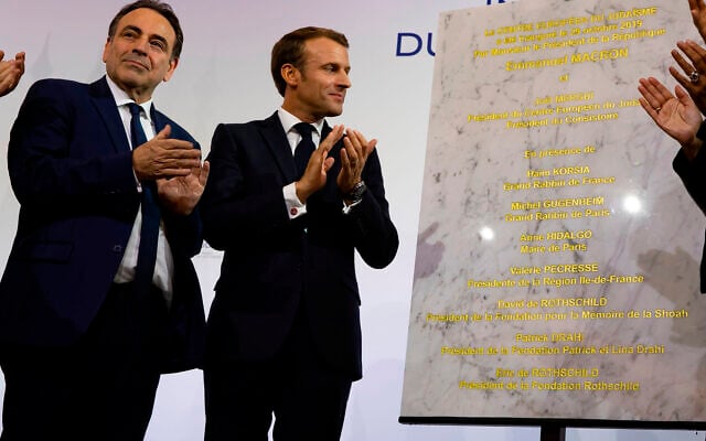 Consistoire President Joel Mergui, left, and French President Emmanuel Macron celebrate the inauguration of a new Jewish community center in Paris, October 29, 2019. (Consistoire) Consistoire President Joel Mergui, left, and French President Emmanuel Macron celebrate the inauguration of a new Jewish community center in Paris, October 29, 2019. (Consistoire)