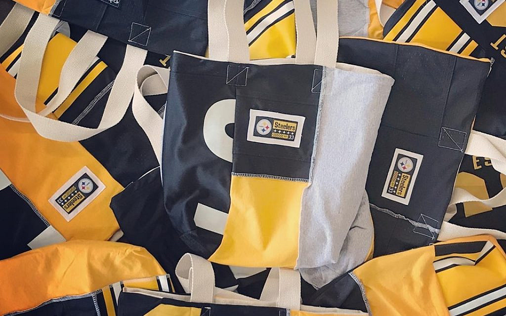 Old Pittsburgh Steelers marketing materials were turned into useful and environmentally-conscious accessories by Massachusetts-based Refried Apparel (courtesy)