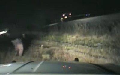 Dashcam footage of a a Utah state trooper rushing to rescue a man from an oncoming train (video screenshot)