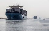 A container ship sails through the new section of the Suez Canal in the Egyptian port city of Ismailia, 135 kilometers northeast of the capital Cairo on October 10, 2019. (Khaled Desouki/AFP)