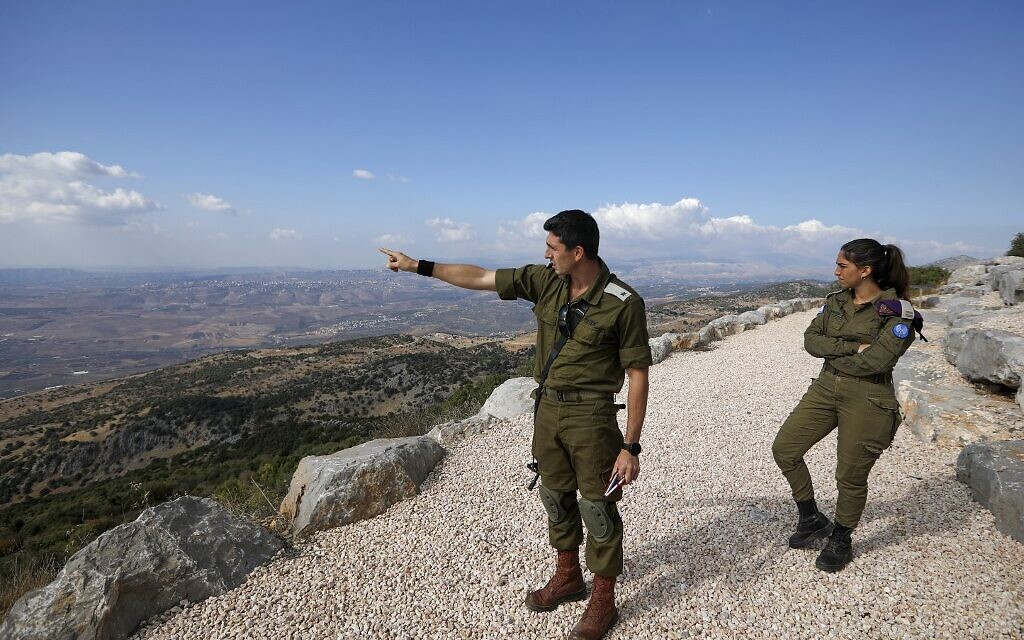 IDF soldier Samuel Boujenah, center, gestures as he explains the Israel-Lebanon conflict to foreign journalists in the military base of Har Dov on Mount Hermon, a strategic and fortified outpost at the crossroads between Israel, Lebanon and Syria, on October 30, 2019. (JALAA MAREY/AFP) IDF soldier Samuel Boujenah, center, gestures as he explains the Israel-Lebanon conflict to foreign journalists in the military base of Har Dov on Mount Hermon, a strategic and fortified outpost at the crossroads between Israel, Lebanon and Syria, on October 30, 2019. (JALAA MAREY/AFP)