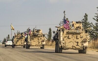 A convoy of US troops outside the Kurdish-majority city of Qamishli, in Syria's northeastern Hasakeh province, November 2, 2019. (Delil Souleiman/AFP)