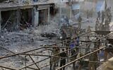 Turkey-backed Syrian fighters inspect the site of a car bomb explosion in the northern Syrian Kurdish town of Tal Abyad, on the border with Turkey, November 2, 2019. (Bakr Alkasem/AFP)