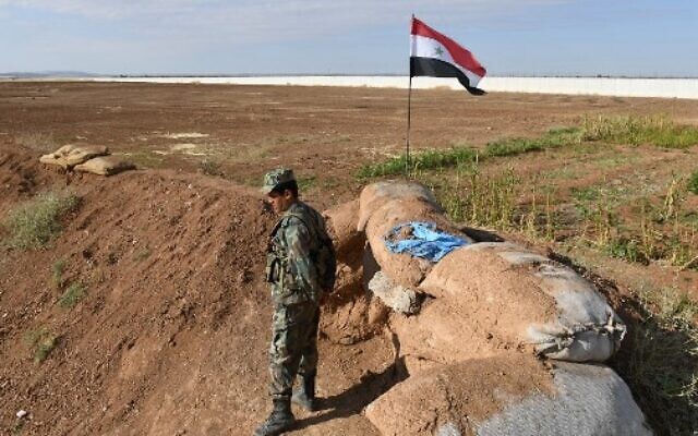 A Syrian soldier mans a position in the countryside of the city of Kobane, also known as Ain al-Arab, along the border with Turkey on November 3, 2019. (AFP) A Syrian soldier mans a position in the countryside of the city of Kobane, also known as Ain al-Arab, along the border with Turkey on November 3, 2019. (AFP)