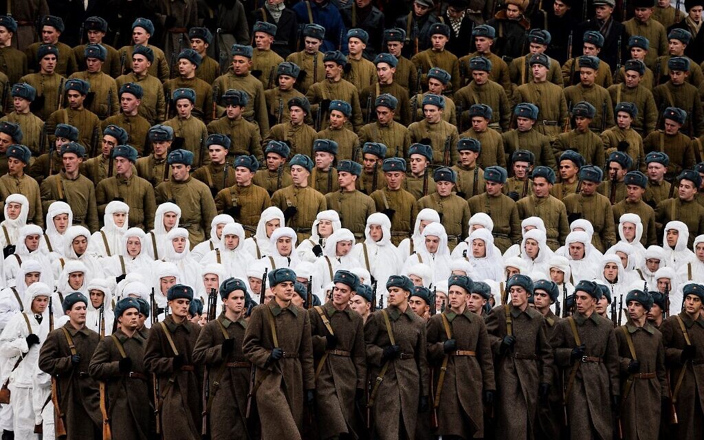 Russian servicemen dressed in historical uniforms march during the military parade at Red Square in Moscow on November 7, 2019, as part of the ceremonies marking the 78th anniversary of the 1941 historical parade, when Red Army soldiers marched past the Kremlin walls towards the front line to fight Nazi Germany troops during World War II. ( Dimitar DILKOFF / AFP)