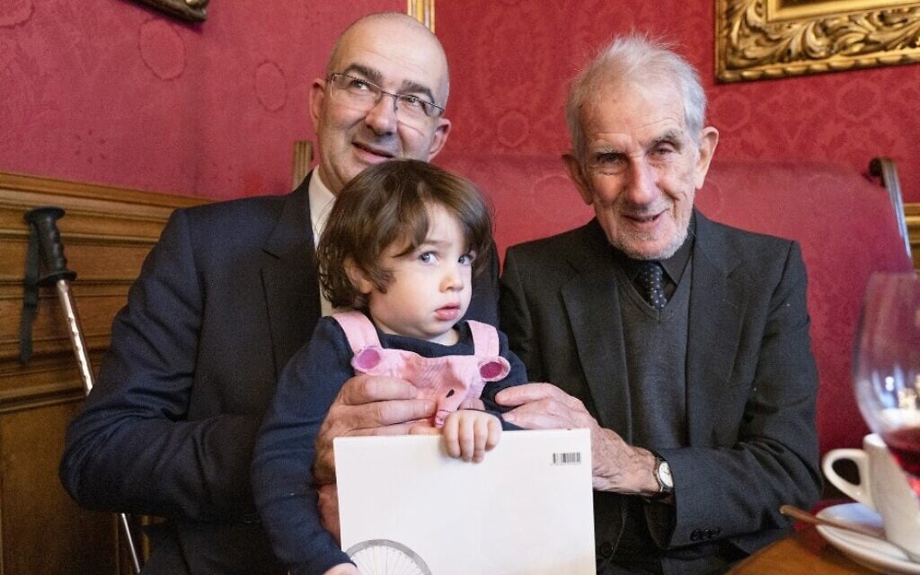 Two-year-old Emmy de Waal is held by her father John de Waall (L) and grandfather Victor de Waal during their reunion in Vienna, Austria on November 4, 2019. Ephrussi family members returned to Vienna in November for their first reunion in more than eight decades to attend the opening of an exhibition about their family story (JOE KLAMAR / AFP) Two-year-old Emmy de Waal is held by her father John de Waall (L) and grandfather Victor de Waal during their reunion in Vienna, Austria on November 4, 2019. Ephrussi family members returned to Vienna in November for their first reunion in more than eight decades to attend the opening of an exhibition about their family story (JOE KLAMAR / AFP)