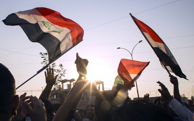 Iraqis demonstrate outside the Basra Governorate's building on November 11, 2019 in the southern city of Basra. (Photo by Hussein FALEH / AFP) Iraqis demonstrate outside the Basra Governorate's building on November 11, 2019 in the southern city of Basra. (Photo by Hussein FALEH / AFP)