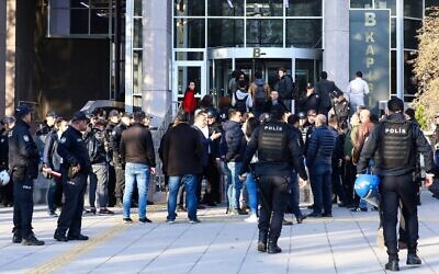 People arrive at the Ankara's courthouse on November 12, 2019, to attend the trial of 18 students and an academic allegedly involved in a banned LGBTI pride event at the campus university, in Ankara. (Photo by Adem ALTAN / AFP)