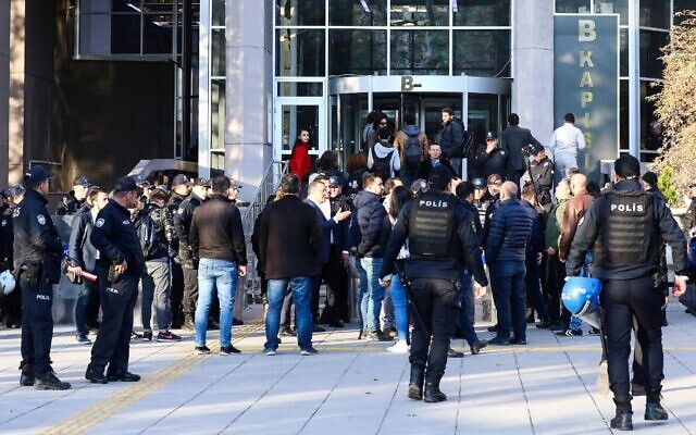 People arrive at the Ankara's courthouse on November 12, 2019, to attend the trial of 18 students and an academic allegedly involved in a banned LGBTI pride event at the campus university, in Ankara. (Photo by Adem ALTAN / AFP) People arrive at the Ankara's courthouse on November 12, 2019, to attend the trial of 18 students and an academic allegedly involved in a banned LGBTI pride event at the campus university, in Ankara. (Photo by Adem ALTAN / AFP)