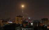 Illustrative: An Israeli missile launched from an Iron Dome missile defense system, designed to intercept and destroy incoming short-range rockets and artillery shells, is seen above Gaza City on November 13, 2019. (Mahmud Hams/AFP)
