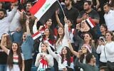Iraq fans cheer during the FIFA World Cup 2022 and the 2023 AFC Asian Cup qualifying soccer match between Iraq and Iran in the Jordanian capital Amman on November 14, 2019. (Khalil MAZRAAWI / AFP)