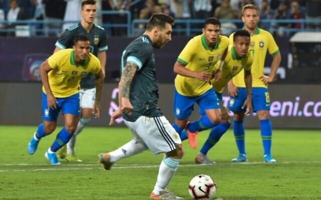 Argentina's forward Lionel Messi runs up to take a penalty during the friendly football match between Brazil and Argentina at the King Saud University stadium in the Saudi capital Riyadh on November 15, 2019. (Photo by Fayez Nureldine / AFP) Argentina's forward Lionel Messi runs up to take a penalty during the friendly football match between Brazil and Argentina at the King Saud University stadium in the Saudi capital Riyadh on November 15, 2019. (Photo by Fayez Nureldine / AFP)