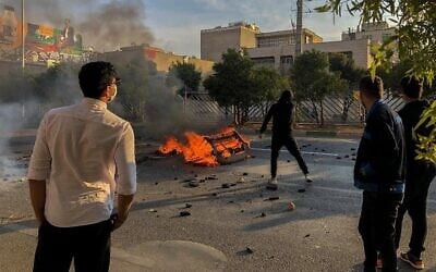 Iranian protesters block a road during a demonstration against an increase in gasoline prices in the central city of Shiraz on November 16, 2019. (AFP)