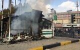 Iranians gather around a charred police station that was set ablaze by protesters during a demonstration against a rise in gasoline prices in the central city of Isfahan on November 17, 2019. (AFP)