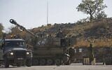 An Israeli M109 self-propelled howitzer is stationed near the border with Syria in the Israeli-annexed Golan Heights on November 19, 2019, after Israeli air defenses intercepted four rockets fired from neighboring Syria. (JALAA MAREY / AFP)