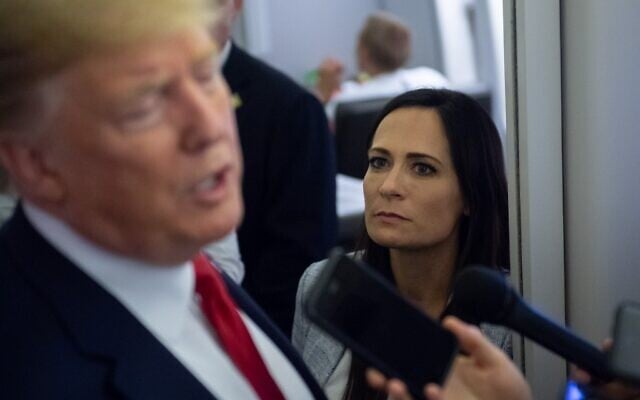 In this file photo taken on August 8, 2019, White House Press Secretary Stephanie Grisham listens as US President Donald Trump speaks to the media aboard Air Force One while flying between El Paso, Texas and Joint Base Andrews in Maryland. (Photo by SAUL LOEB / AFP) In this file photo taken on August 8, 2019, White House Press Secretary Stephanie Grisham listens as US President Donald Trump speaks to the media aboard Air Force One while flying between El Paso, Texas and Joint Base Andrews in Maryland. (Photo by SAUL LOEB / AFP)
