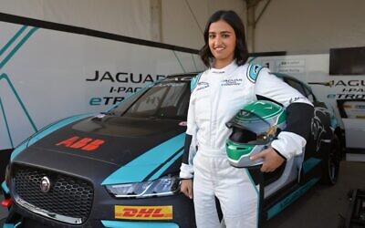 Reema al-Juffali, Saudi Arabia's first female race driver, poses in front of her car during an interview with AFP in Diriyah district in Riyadh on November 20, 2019. (Fayez Nureldine/AFP)