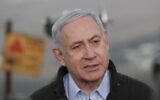 Prime Minister Benjamin Netanyahu visits an army base on the Golan Heights, November 24, 2019. (Atef Safadi/Pool/AFP)