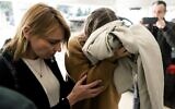 This picture taken on November 28, 2019, shows a British teenager (R), who was then accused of falsely claiming she was gang raped by Israeli tourists, covering her face as she arrives for her trial at the Famagusta District Court in Paralimni in eastern Cyprus. (Iakovos Hatzistavrou / AFP)