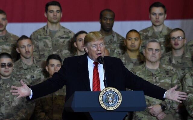 US President Donald Trump speaks to the troops during a surprise Thanksgiving day visit at Bagram Air Field, on November 28, 2019, in Afghanistan. (Olivier Douliery / AFP) US President Donald Trump speaks to the troops during a surprise Thanksgiving day visit at Bagram Air Field, on November 28, 2019, in Afghanistan. (Olivier Douliery / AFP)
