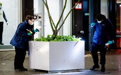 Forensic workers investigate at the Grote Marktstraat, one of the main shopping streets in the center of the Dutch city of The Hague, after several people were wounded in a stabbing incident, November 29, 2019 (Sem Van Der Wal/ANP/AFP)
