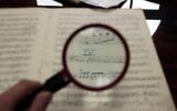 Reconstructed sheet music written on toilet paper and charcoal bags recovered from Nazi concentration camps during World War II. (Courtesy of Francesco Lotoro)