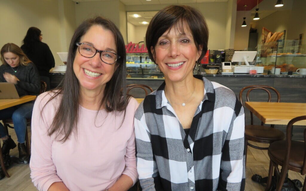 Valerie Habif, left, and Joanie Shubin, who founded the Jewish Democratic Women’s Salon in Atlanta, pose in a cafe in Sandy Springs, a suburb of Atlanta, November 22, 2019. (Ron Kampeas/JTA)