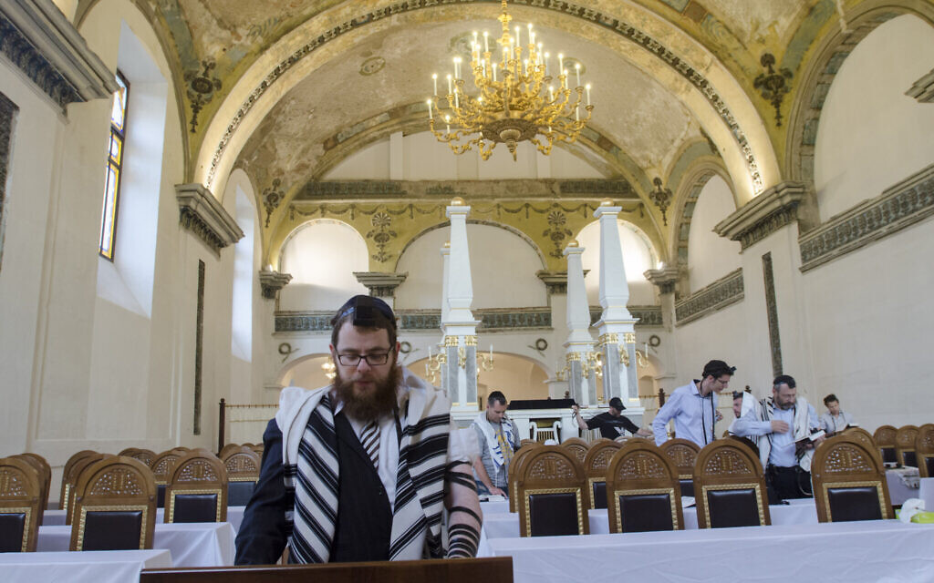 Rabbi Shlomo Koves, left, praying at his Obuda Synagogue in Budapest, Hungary on October 7, 2019. (Courtesy of EMIH/via JTA)