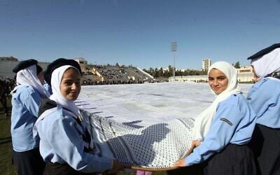 A massive keffiyeh was unveiled this week at a ceremony at a soccer stadium in a southern West Bank town near Hebron. (Credit: Wafa) A massive keffiyeh was unveiled this week at a ceremony at a soccer stadium in a southern West Bank town near Hebron. (Credit: Wafa)