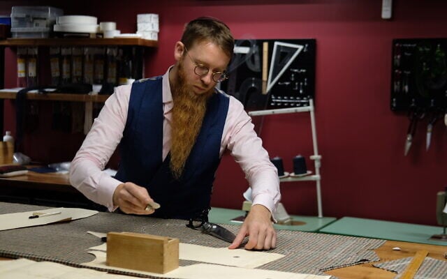 Yosel Tiefenbrun works at his bespoke tailoring house in Williamsburg, Brooklyn. (Courtesy of Tiefenbrun) Yosel Tiefenbrun works at his bespoke tailoring house in Williamsburg, Brooklyn. (Courtesy of Tiefenbrun)
