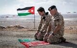 Jordan's King Abdullah II and Crown Prince Hussein pray at the Tzofar enclave after the return of the territory from Israel, November 16, 2019 (Courtesy)
