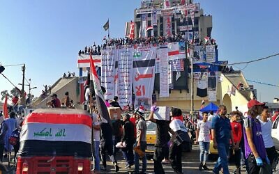 Anti-government protesters gather in Tahrir Square during ongoing protests in Baghdad, Iraq, Friday, Nov. 1, 2019. (AP Photo/Khalid Mohammed) Anti-government protesters gather in Tahrir Square during ongoing protests in Baghdad, Iraq, Friday, Nov. 1, 2019. (AP Photo/Khalid Mohammed)