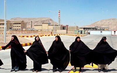 In this Aug. 16, 2005 file photo, Iranian women form a human chain, at the Isfahan Uranium Conversion Facility, in support of Iran's nuclear program, just outside the city of Isfahan, Iran (AP Photo/Vahid Salemi)