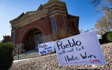 Signs, flowers and candles expressing love for the Jewish community stand outside the Temple Emanuel in Pueblo, Colorado, Nov. 5, 2019 (Christian Murdock/The Gazette via AP)