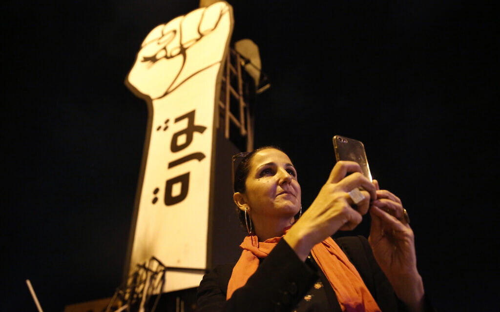 Singer Tania Saleh takes pictures with her mobile phone at the martyrs square where the ongoing anti-government take place everyday, in downtown Beirut, Lebanon, November 8, 2019 (AP Photo/Hussein Malla) Singer Tania Saleh takes pictures with her mobile phone at the martyrs square where the ongoing anti-government take place everyday, in downtown Beirut, Lebanon, November 8, 2019 (AP Photo/Hussein Malla)