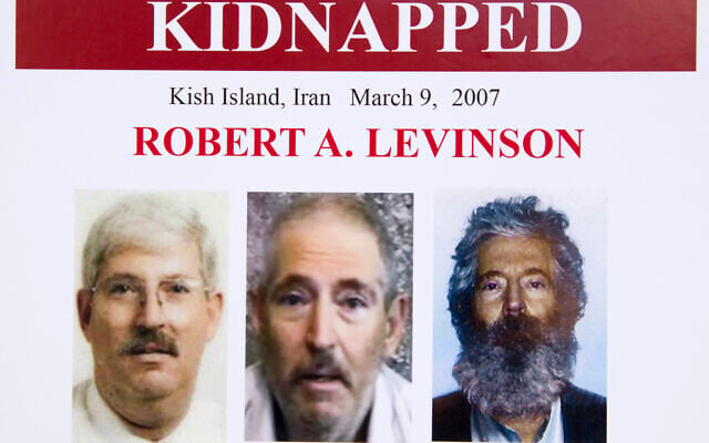 An FBI poster showing a composite image of former FBI agent Robert Levinson, right, of how he would look like now after five years in captivity, and an image, center, taken from the video, released by his kidnappers, and a picture before he was kidnapped, left, displayed during a news conference in Washington, March 6, 2012. (Manuel Balce Ceneta/AP) An FBI poster showing a composite image of former FBI agent Robert Levinson, right, of how he would look like now after five years in captivity, and an image, center, taken from the video, released by his kidnappers, and a picture before he was kidnapped, left, displayed during a news conference in Washington, March 6, 2012. (Manuel Balce Ceneta/AP)