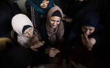 Relatives of Islamic Jihad terrorist Abdullah Al-Belbesi, 26, who was killed in Israeli airstrikes, at his funeral in the town of Beit Lahiya, northern Gaza Strip, November 13, 2019. (AP Photo/Khalil Hamra)
