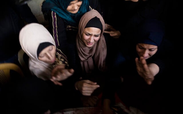 Relatives of Islamic Jihad terrorist Abdullah Al-Belbesi, 26, who was killed in Israeli airstrikes, at his funeral in the town of Beit Lahiya, northern Gaza Strip, November 13, 2019. (AP Photo/Khalil Hamra) Relatives of Islamic Jihad terrorist Abdullah Al-Belbesi, 26, who was killed in Israeli airstrikes, at his funeral in the town of Beit Lahiya, northern Gaza Strip, November 13, 2019. (AP Photo/Khalil Hamra)