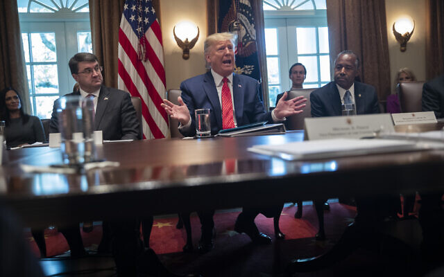US Secretary of Veterans Affairs Robert Wilkie, left, and Secretary of Housing and Urban Development Ben Carson, right, listen as President Donald Trump speaks during a cabinet meeting at the White House, November 19, 2019, in Washington. (AP Photo/ Evan Vucci) US Secretary of Veterans Affairs Robert Wilkie, left, and Secretary of Housing and Urban Development Ben Carson, right, listen as President Donald Trump speaks during a cabinet meeting at the White House, November 19, 2019, in Washington. (AP Photo/ Evan Vucci)