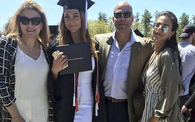 In this May 2019 photo provided by Guila Fakhoury, her father Amer Fakhoury, second from right, gathers with family members at the University of New Hampshire in Durham, New Hampshire. (Guila Fakhoury via AP)