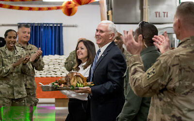 US Vice President Mike Pence and his wife Karen Pence arrive with turkey to serve to troops at Al Asad Air Base, Iraq, Saturday, Nov. 23, 2019. The visit is Pence’s first to Iraq and comes nearly one year since President Donald Trump’s surprise visit to the country. (AP Photo/Andrew Harnik)