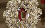 A wooden relic believed to be from Jesus' manger is seen at the Notre Dame church in Jerusalem, Friday, Nov. 29, 2019. Christians are celebrating the return to the Holy Land of a tiny wooden relic believed to be from Jesus' manger nearly 1,400 years after it was sent to Rome as a gift to the pope. (AP Photo/ Mahmoud Illean)