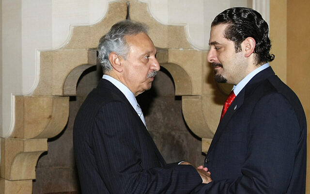 File: Saad Hariri, right, speaks with then-transportation minister Mohammad Safadi at the French ambassador's residence in Beirut, Lebanon, July 29, 2007. (AP Photo/Marwan Naamani, Pool) File: Saad Hariri, right, speaks with then-transportation minister Mohammad Safadi at the French ambassador's residence in Beirut, Lebanon, July 29, 2007. (AP Photo/Marwan Naamani, Pool)