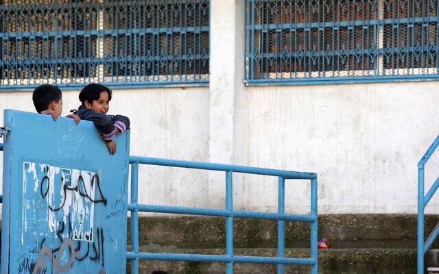 Two boys climb their UNRWA school's gate in Al Nasr refugee camp in Amman, Jordan, February 1, 2010, after the end of the first day of the second semester of the school year (AP Photo/Mohammad Abu Ghosh) Two boys climb their UNRWA school's gate in Al Nasr refugee camp in Amman, Jordan, February 1, 2010, after the end of the first day of the second semester of the school year (AP Photo/Mohammad Abu Ghosh)