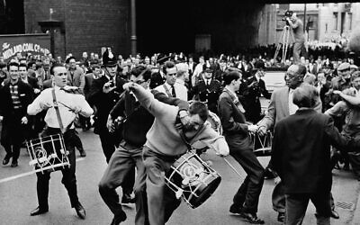 Illustrative: An irate spectator attacks a drummer of British fascist leader Sir Oswald Mosley during a march through Manchester, England on July 29, 1962. Rocks and tomatoes were hurtled towards some 40 marchers before they were physically attacked by the crowd. (AP Photo)
