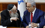 Benjamin Netanyahu, right, listens to Yaakov Litzman at the start of the the weekly cabinet meeting at the prime minister's office in Jerusalem,  January 6, 2019. (Gali Tibbon/Pool via AP)