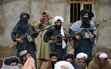 In this Nov. 3, 2015 file photo, Afghan Taliban fighters listen to Mullah Mohammed Rasool, the newly-elected leader of a breakaway faction of the Taliban, in Farah province, Afghanistan (AP Photo, File)