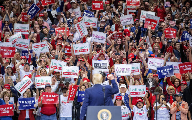 US President Donald Trump greets supporters as he walks on stage during a campaign rally, Thursday, Oct. 17, 2019, at the American Airlines Center in Dallas. (AP Photo/Jeffrey McWhorter) US President Donald Trump greets supporters as he walks on stage during a campaign rally, Thursday, Oct. 17, 2019, at the American Airlines Center in Dallas. (AP Photo/Jeffrey McWhorter)